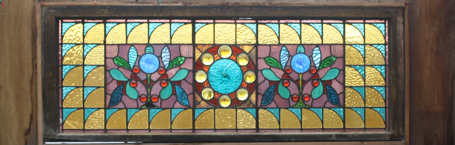 A piece of stained glass decorates the entrance to Greenbridge Pottery