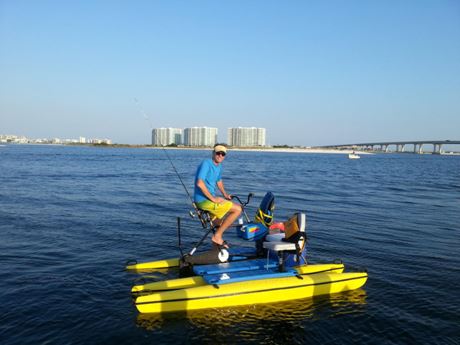 Man sitting on Hydrobike in bay