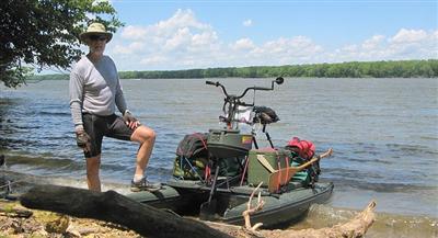 Tom standing with his hydrobike on the shore