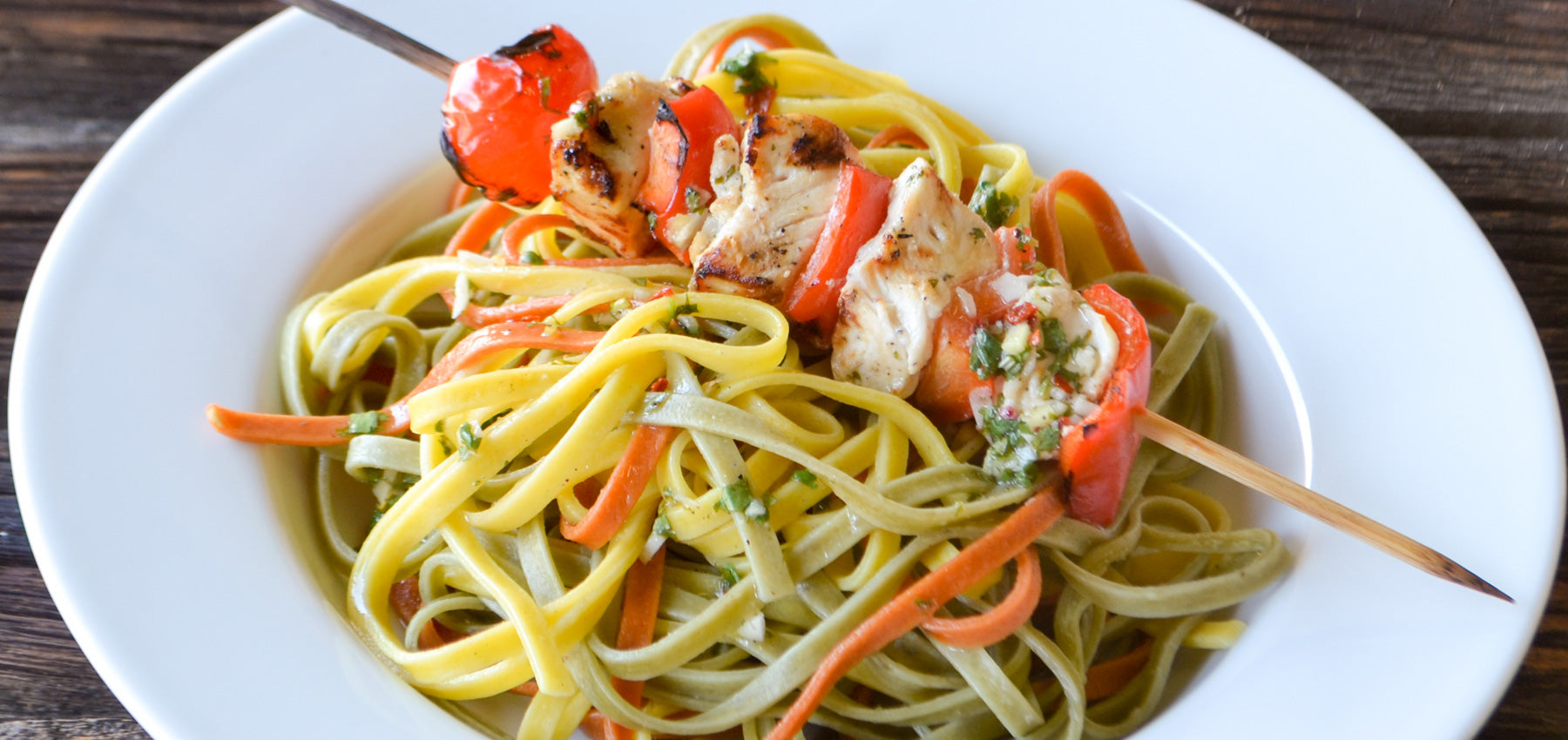 Cilantro Lime Chicken Skewers over Bell Pepper Trio Linguine