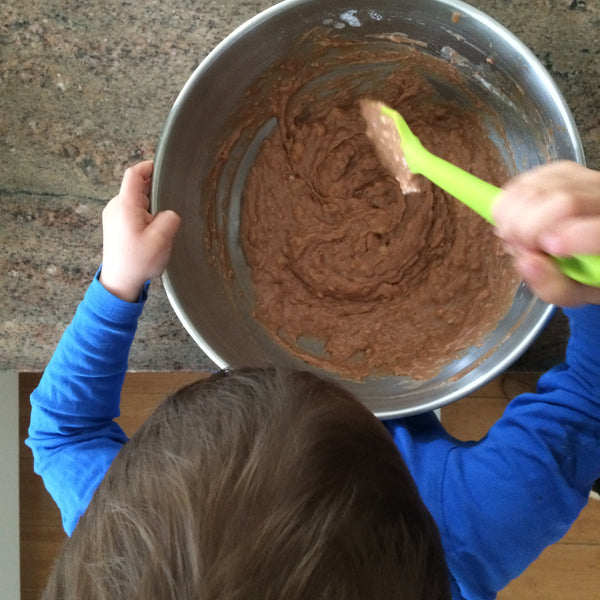 Image of a child stiring a bowl of cake mixture