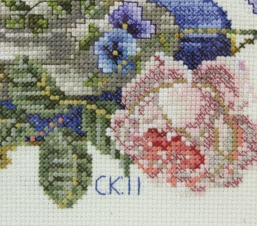 The signature of Carmelita Kaser on her final needlework project