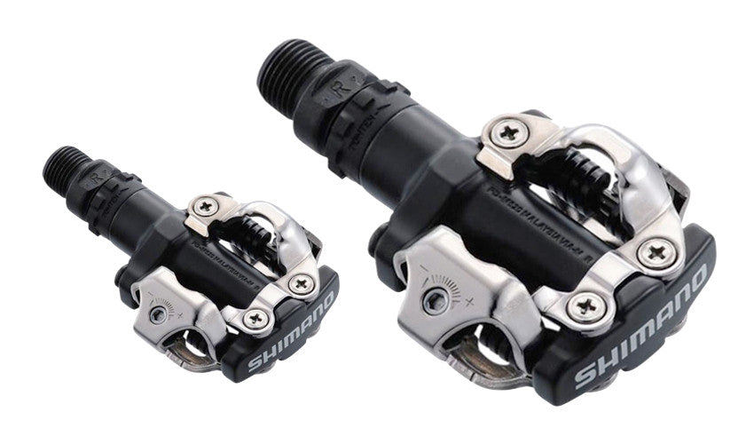 A close-up view of a pair of Shimano clipless pedals