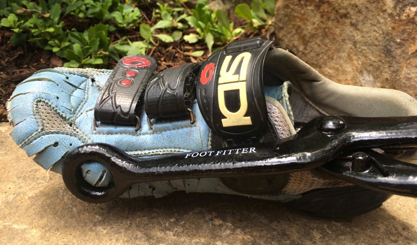 The FootFitter Shoe Stretcher applied to the toe box of a conventional road cycling shoe