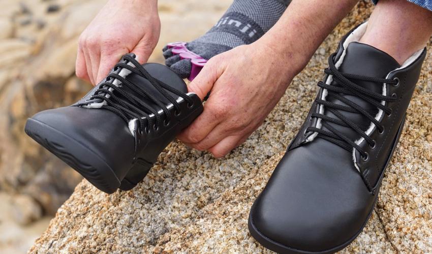 A hiker using Correct Toes toe spacers and Injinji toe socks in combination with Ahinsa Bare Ankle Lifo+ boots in Black