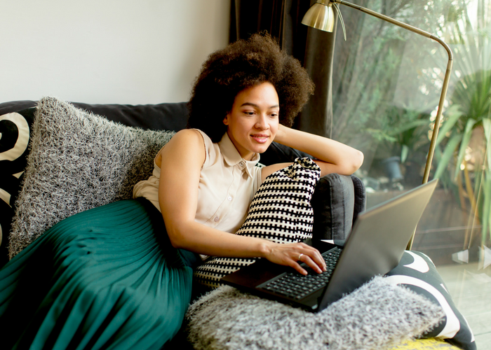 black woman reading magazine