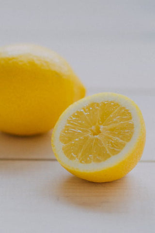 Sliced lemon against an off-white background