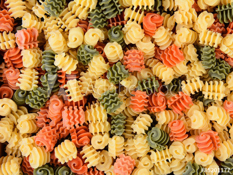 Multi colored pasta noodles, green, yellow and orange