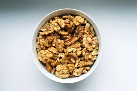 A bowl of shelled walnuts.
