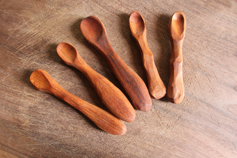 Handmade wooden baby spoons made from domestic urban cherry lumber.