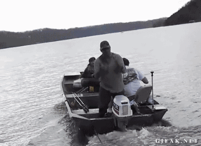 man falling out of boat trying to catch a beer can