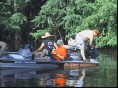 men falling overboard after boat backfires