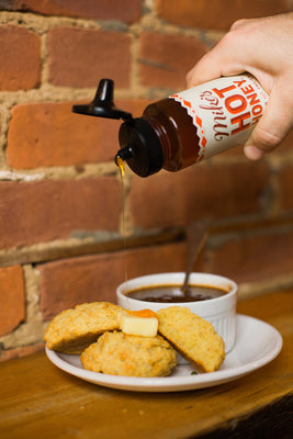 Chili & house-made biscuits with Mike's Hot Honey at 61 Local