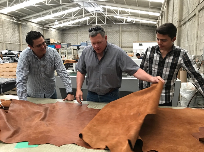 Scott reviewing leather with Joel Hernandez and Aaron Trejo at Fivax