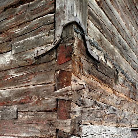 Metal bracing on old wooden building