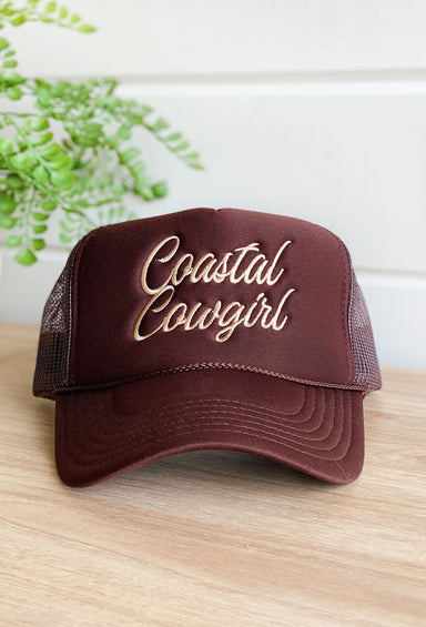 Charlie Southern: Coastal Cowgirl Trucker Hat, brown trucker hat with tan embroidered that says "coastal cowgirl"