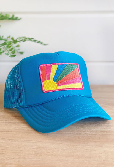 Chasing Sunshine Trucker Hat, blue hat with sun ray & rainbow patch 