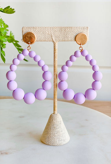 Choosing Joy Earrings in Lavender, teardrop shaped earring with purple balls 