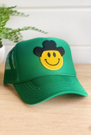 Happy Cowboy Trucker Hat in Green, green trucker ht with smiley face wearing a cowboy hat