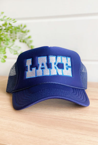 Charlie Southern: Lake Trucker Hat, blue trucker hat with embroidered "lake" on the front