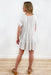 Mornings In Mexico Dress in Oatmeal, Oatmeal colored mini dress with a babydoll effect, Elastic sleeves and a V neckline