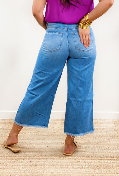 Olivia Wide Leg Denim by Vervet.  Classic medium wash and trendy distressing Jenas. Wide leg fit with frayed hem.