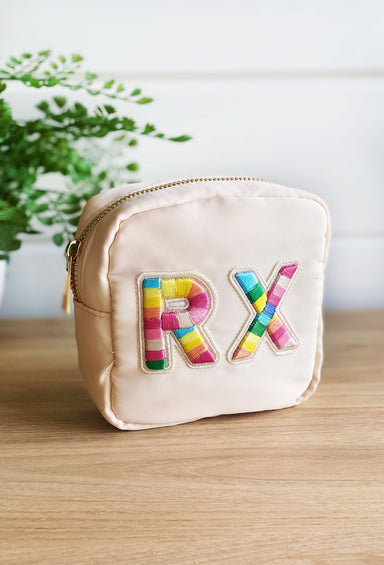 RX Nylon Mini Pouc, neutral nylon design with eye-catching, striped embroidered patches that spell out “RX”