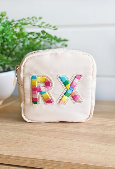 RX Nylon Mini Pouc, neutral nylon design with eye-catching, striped embroidered patches that spell out “RX”