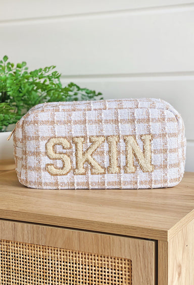 Skin Plaid Cosmetic Bag,  neutral plaid palette and fun textured embroidered patch that say "Skin" outlined in gold glitter