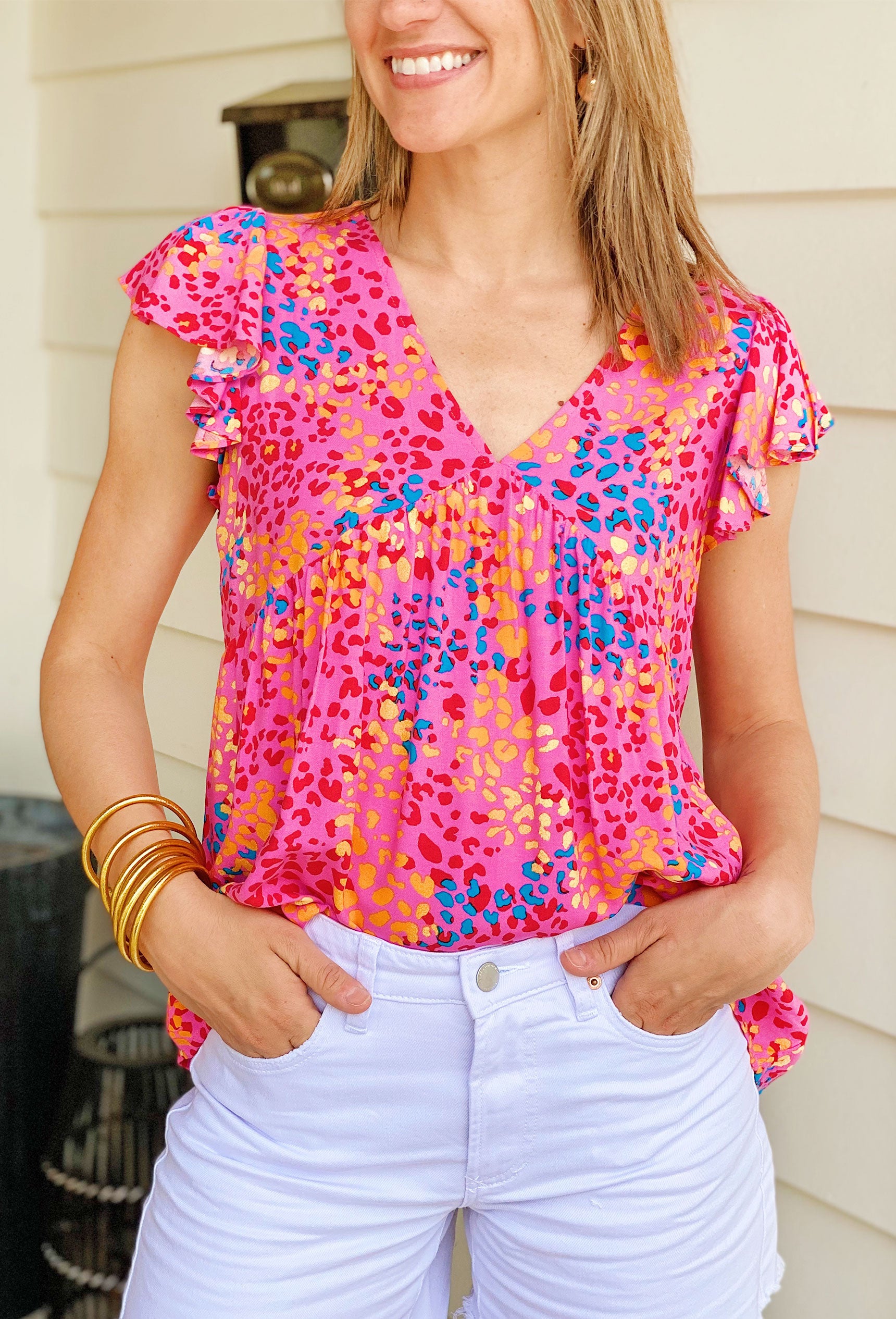 Spotted in Santorini Leopard Top, pink babydoll blouse with rainbow leopard design
