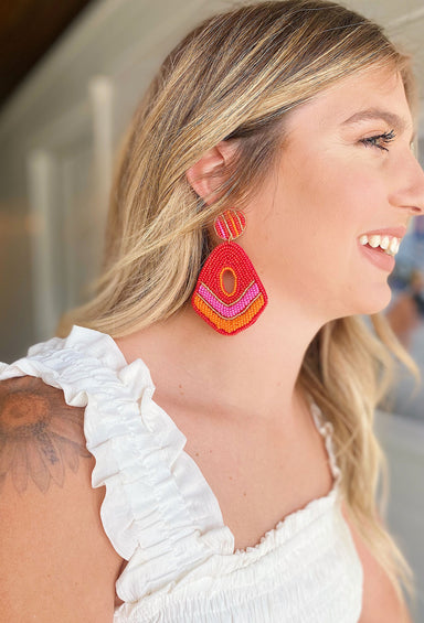 Bondi Beach Beaded Earrings, Teardrop shaped earring with a hole in the middle, pink, red, orange and gold beads, felt backing, post back