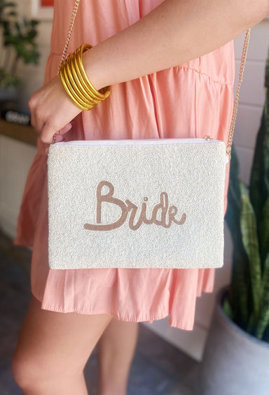 Bride Beaded Handbag, white beaded background with "bride" in gold beads, crossbody strap