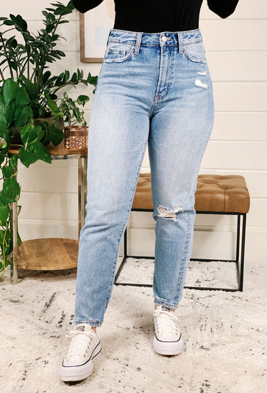 Distressed Mom Jeans by Vervet, light washed mom jeans with a hole in the left knee 