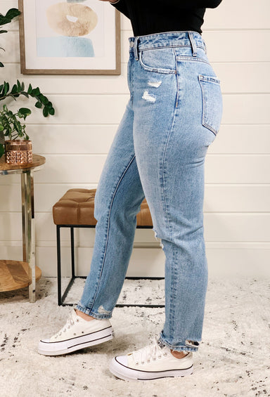 Distressed Mom Jeans by Vervet, light washed mom jeans with a hole in the left knee 