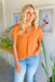 Kerry Blouse in Tangerine, Short sleeve top with v-neck with pleated detailing 