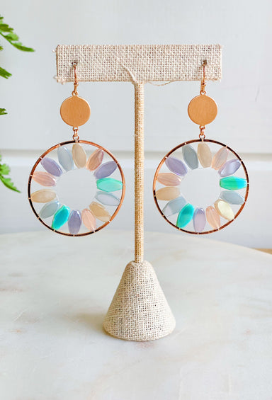 Lost In The Moment Earrings, gold drop earrings with pastel colored gems around the circle