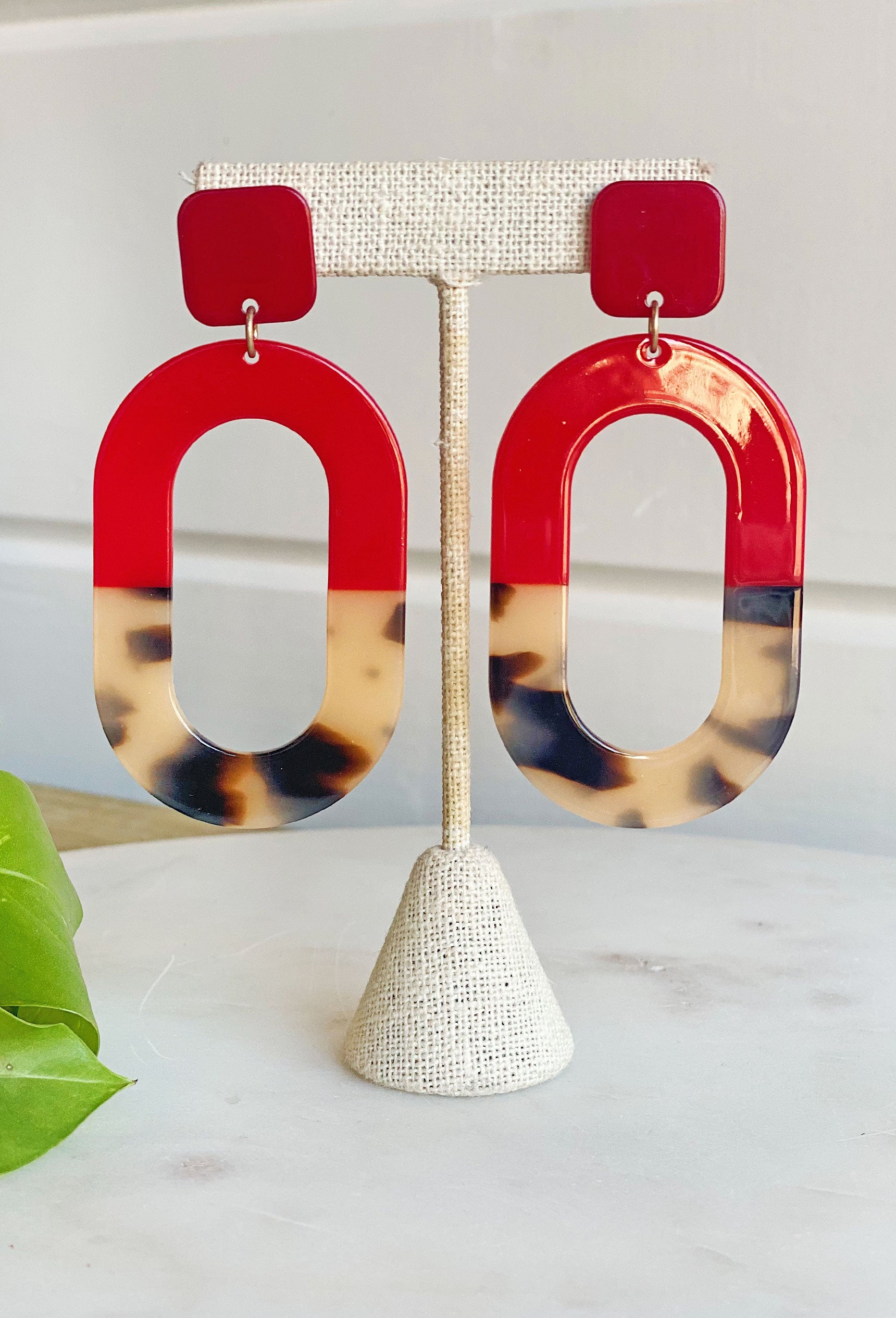 Madly in Love Earrings, hallow oval shape that's half red and half tortoise 