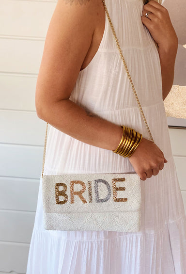 Metallic Bride Beaded Handbag, white beaded bag with "BRIDE" beaded in metallic colors across the top flap. removable crossbody chain