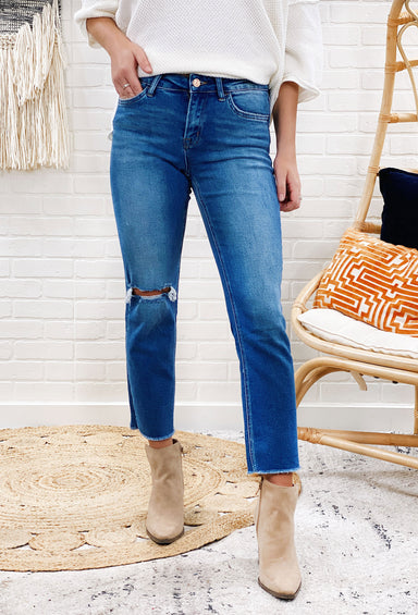 Mid Rise Straight Crop Jeans by Vervet, stretch denim with a cropped length, distressing along the right knee, slim straight fit, raw edge hem