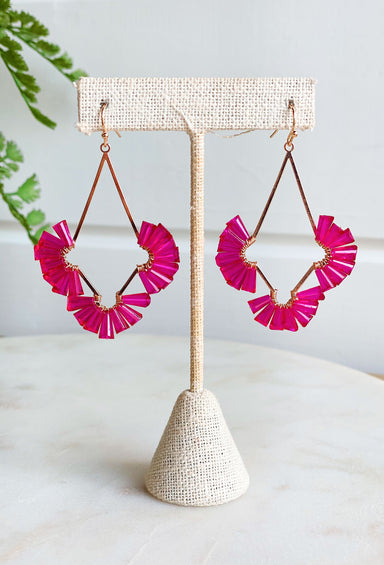 One Thing Earrings in Fuschia, gold drop earrings with fuschia gems fanned out on each side