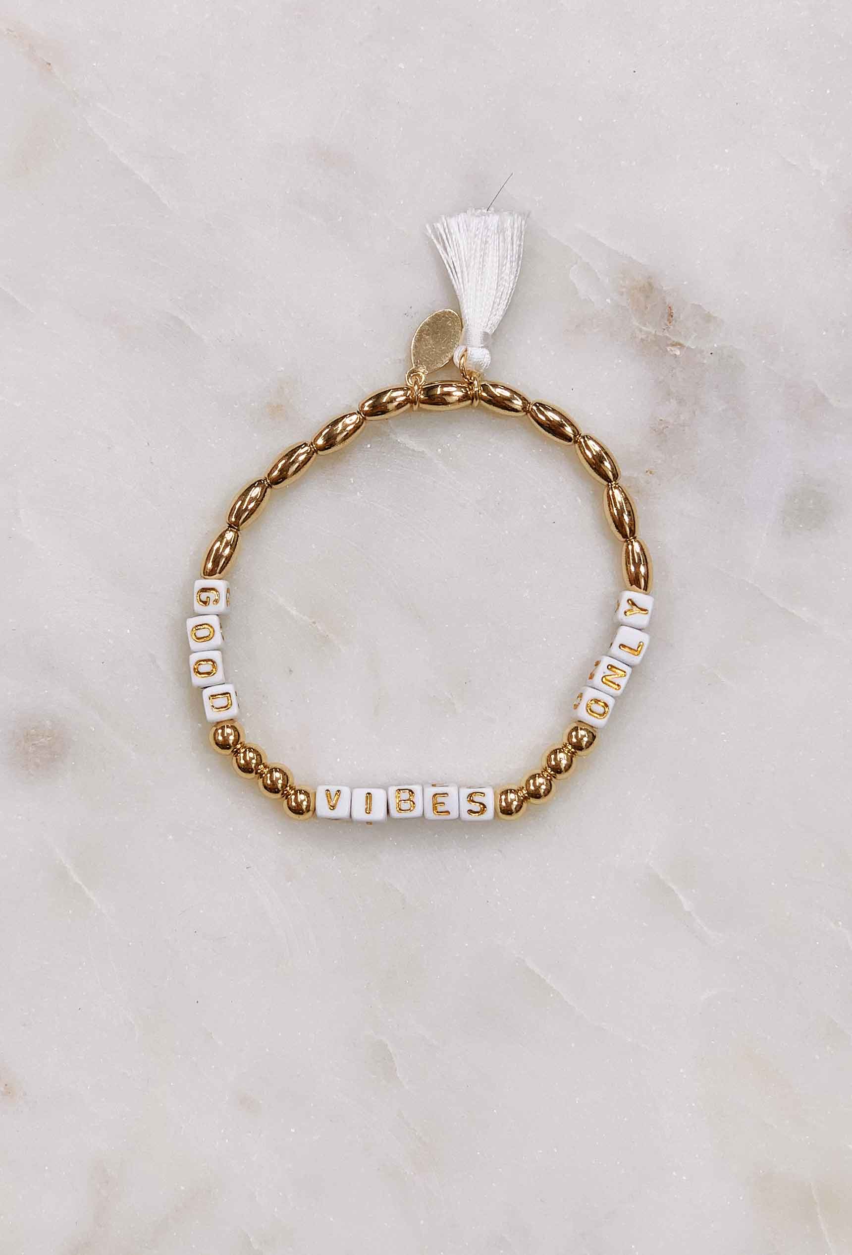 Positivity Bead & Tassel Bracelet, gold bead white block letter tassel bracelet