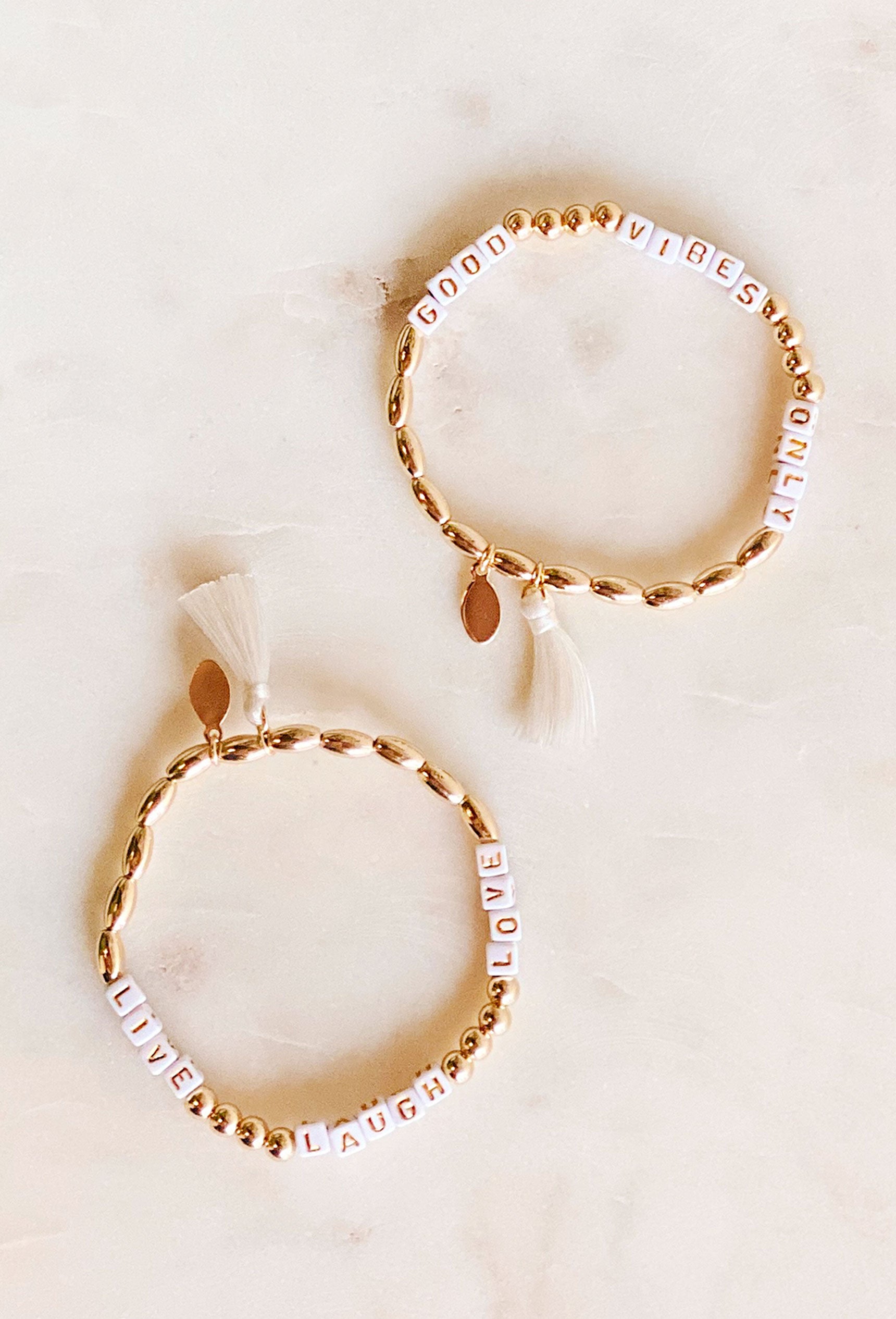 Positivity Bead & Tassel Bracelet,  gold bead white block letter tassel bracelet 