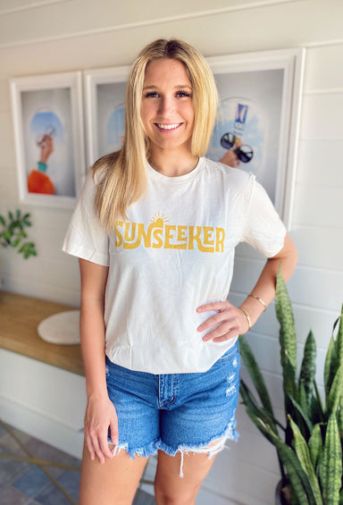 Sun Seeker Graphic Tee, cream colored tee, "sun seeker" written across front of shirt in yellow