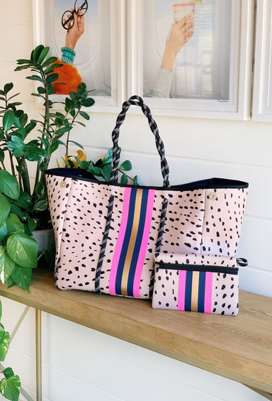The Christi Exotic Neoprene Tote, light pinkish tan antelope neoprene tote with a hot pink, navy and champagne stripe down the front 