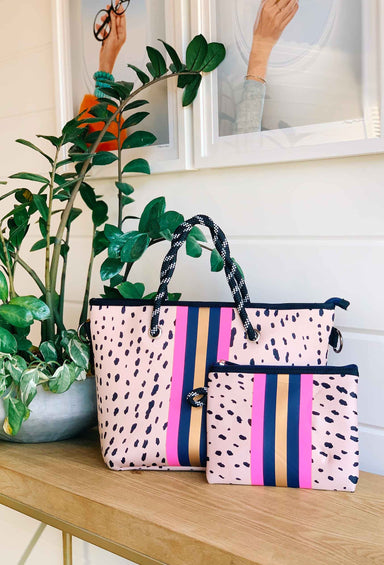 The Christi Neoprene Mini Tote, pink antelope print mini neoprene tote with small privacy catch all pouch and a pink and navy satchel strap