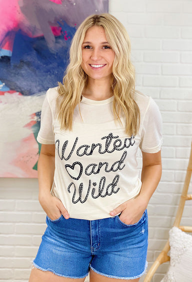 Wanted And Wild Graphic Tee, tan shirt, crewneck, wanted and wild written in rope on front of shirt