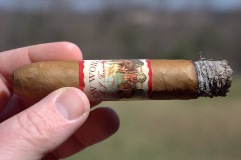 Image of a lit AJ Fernandez New World Connecticut Belicoso cigar