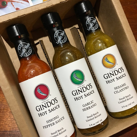 Gindo's Bento Box, an Asian-inspired collection of hot sauces. Hmong Pepper Sauce, Garlic Serrano, Sesame Cilantro.
