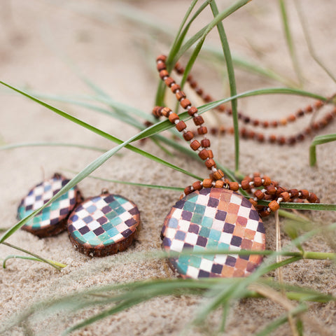 necklaces and earrings handmade on wood by Mon Manabu, featured in Finders Keepers