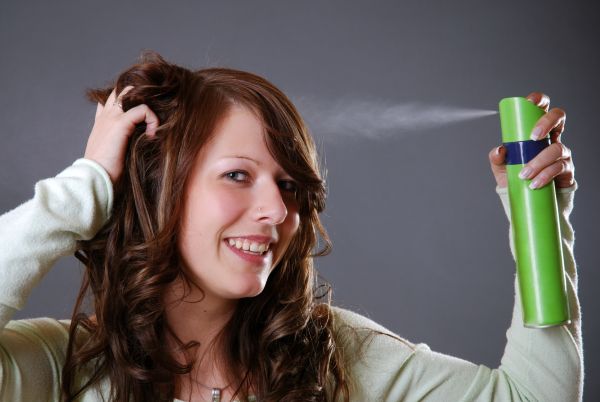 Brunette Applying Dry Shampoo To Get Rid Of An Oily Scalp ISA Professional